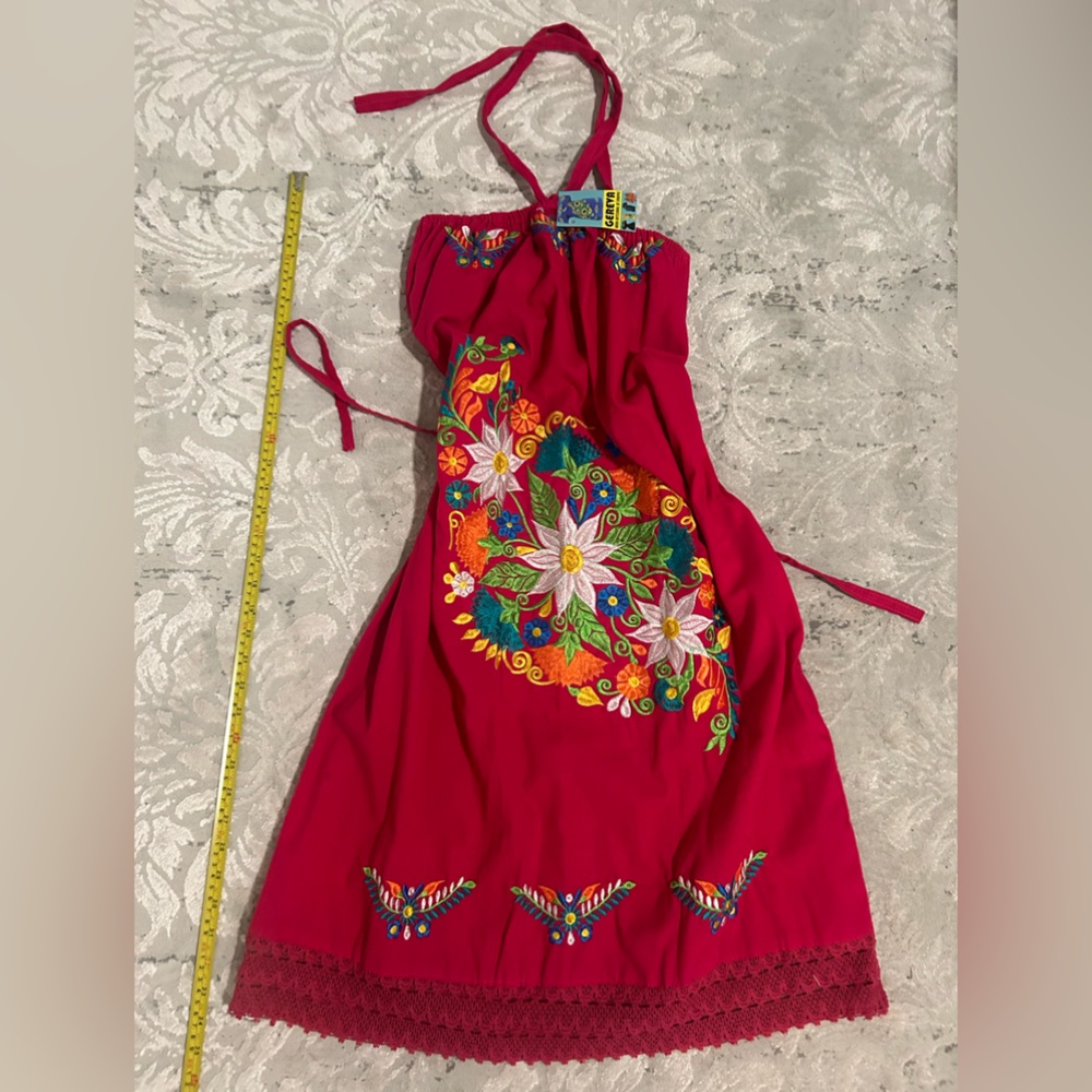 Fuchsia pink with embroidered flowers.  Mexican inspired dress size large